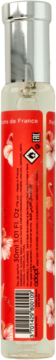 Tył butelki Adopt' Sunset Kiss 30ml, czerwona etykieta z białymi flamingami, nuty liczi i róży, kod kreskowy.