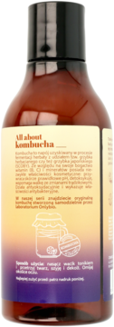 Tył brązowej butelki toniku Onlybio z kombuchą. Etykieta z tekstem All about kombucha i instrukcją użycia.