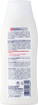 Tył białej butelki balsamu do ciała z solą z Morza Martwego, widoczny kod kreskowy i etykieta z tekstem.