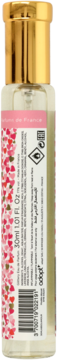 Tył butelki Adopt' Absolu D'Amour wody perfumowanej, złoty korek, etykieta z różowymi sercami i kodem.