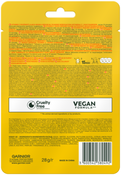 Tył żółtej saszetki nawilżającej maski Garnier Skin Naturals z witaminą C i kwasem hialuronowym, napisy i kod.