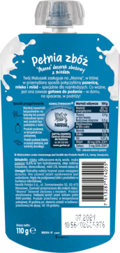 Tył niebieskiej saszetki Nestlé Manna deser zbożowy z miodem, widoczne wartości odżywcze i kod kreskowy.