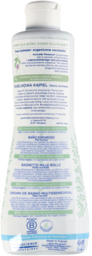 Tył białej butelki Mustela Bąbelkowa Kąpiel z organicznym awokado. Widoczna etykieta z tekstem PL/ES/IT/PT i certyfikatami.