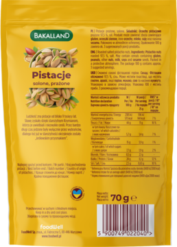 Tylna strona złotego opakowania Bakalland Pistacje solone prażone 70g z tabelą wartości odżywczych.