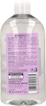 Tył przezroczystej butelki ISANA Płyn Micelarny 3w1 400ml dla skóry suchej, z fioletową etykietą producenta.
