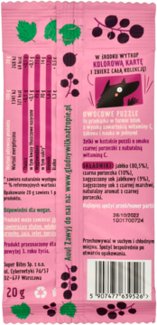 Tył różowego opakowania Owocowych Puzzli, żelek witaminowych o smaku czarnej porzeczki, z tabelą wartości odżywczych.