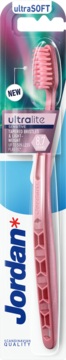 Jordan Ultralite ultraSOFT pink toothbrush (8.7g) for sensitive gums, front view in blister packaging.