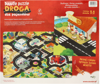 Czerwone pudełko z puzzlami Droga dla pojazdów, prezentujące zmontowaną mapę miasta i fragment pizzerii.