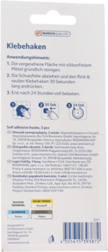 Tył opakowania samoprzylepnych haczyków Rossmann (3 sztuki), białe z niemieckimi instrukcjami i piktogramami.