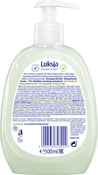 Tył jasnozielonej butelki mydła Luksja Creamy & Soft 500ml, widoczna etykieta z opisem i kodem.