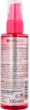 Różowa butelka Isana Professional olejku do włosów czarny bez & truskawka, 100ml, widok od tyłu z tekstem.