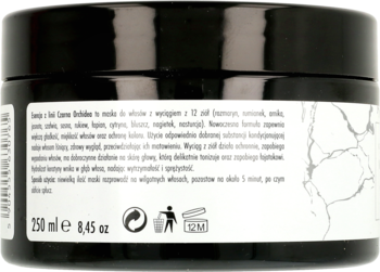 Tył czarnej maski do włosów z 12 ziołami, z białą etykietą zawierającą polski opis, objętość 250ml i symbole.