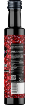 Butelka soku z granatu 250 ml, widok z tyłu z czerwoną etykietą, pestkami i tabelą wartości odżywczych.