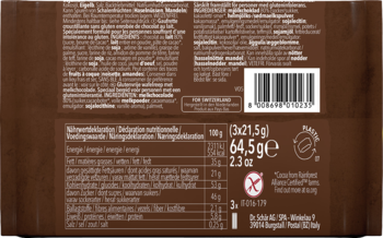 Zbliżenie na tył brązowego opakowania batona, z tabelą odżywczą, kodem kreskowym i symbolem bez glutenu.