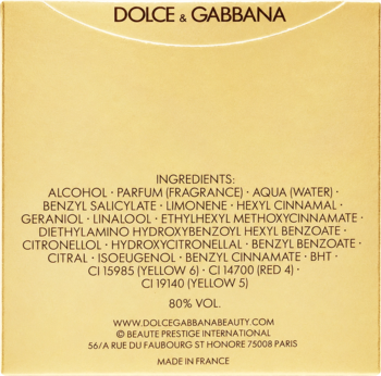 Tył opakowania perfum Dolce & Gabbana, zbliżenie na listę składników. Złote tło, biały tekst, Made in France.