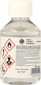 Terpentyna balsamiczna Astra w butelce, widok z tyłu z etykietą i piktogramami ostrzegawczymi, do farb.