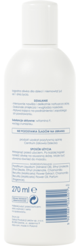 Tył białej butelki Łagodnej oliwki dla dzieci, widoczny skład z witaminą F i rumiankiem.