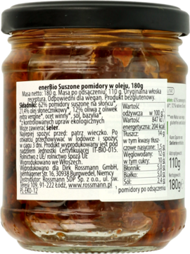 Tył szklanego słoika z suszonymi pomidorami w oleju, widoczna biała etykieta z polskimi informacjami o produkcie.