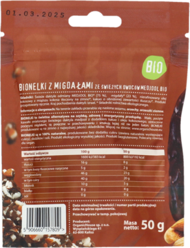 Tył brązowej torebki BIONELKI z migdałami i daktylami BIO 50g, widoczna pełna tabela wartości odżywczych.