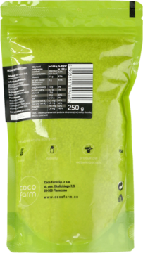 Tył zielonej torebki Coco Farm białego sezamu 250g z etykietą; widoczne wartości odżywcze i kod.