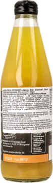 Tył szklanej butelki enerBio Sok na Odporność, 330ml, z witaminą B12+C. Widoczna etykieta z opisem i datą.