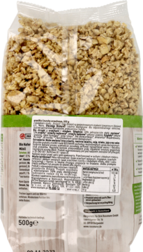 Tył przezroczystego opakowania enerBio Crunchy orzechowe 500g, z etykietą i widoczną orzechową granolą.