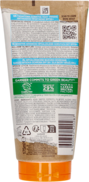 Tył opakowania mleczka ochronnego Garnier Ambre Solaire Sensitive Advanced SPF 50+, z listą składników i symbolami.