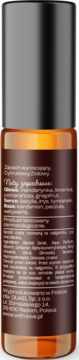 Amber roll-on fragrance bottle, black cap, back view, with white text detailing citrus and herbal notes.