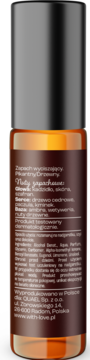 Tylna strona brązowej butelki perfum w roll-onie z czarną nakrętką, opis nut zapachowych: kadzidło, cedr, ambra.