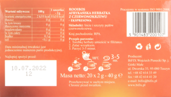 Tył pomarańczowego opakowania herbaty Rooibos, z tabelą wartości odżywczych, instrukcją parzenia i datą 10.07.2022.
