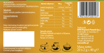 Tył złotobrązowego opakowania herbatki Rooibos, z tabelą wartości odżywczych, kodem kreskowym i ikonami.
