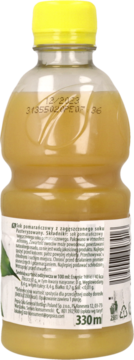 Tył butelki soku pomarańczowego Toma 330ml z zagęszczonego soku, z żółtą nakrętką i etykietą.