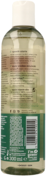 Tył zielono-przezroczystej butelki szamponu tołpa I'm green 300 ml, z kodem kreskowym i opisem składu.