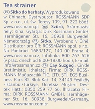 Jasny beżowy kartonik z ciemnoszarym tekstem o sitku do herbaty i danych dystrybutora Rossmann.