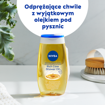 NIVEA Rich Care Shower Oil w przezroczystej, żółtej butelce z niebieską nakrętką, widok z przodu.