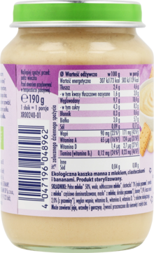 Tył szklanego słoiczka ekologicznej kaszki manny z mlekiem, ciasteczkami i bananami. Etykieta ze składem.