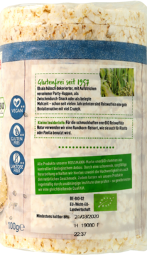 Tył przezroczystego opakowania wafli ryżowych enerBio 100g. Widoczne zielone etykiety i tekst o bezglutenowości.