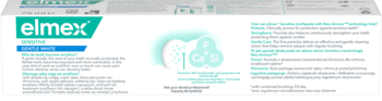 Biała ulotka pasty elmex Sensitive Gentle White z zielonym logo i grafiką zębów, opisuje technologię Neo-Aminex.