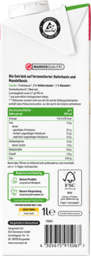 Tył opakowania enerBIO Bio napoju owsiano-migdałowego, z tabelą wartości odżywczych i logo FSC.