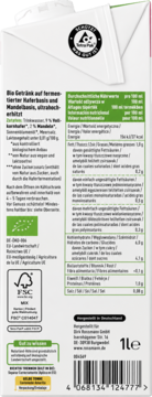 Tył białego kartonu Bio napoju owsiano-migdałowego enerBIO z tabelą wartości odżywczych i składnikami.