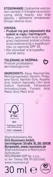 Tył opakowania serum Isana Love Your Skin z niacynamidem i gliceryną, widoczne skład i instrukcje.