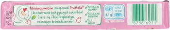 Różowe opakowanie cukierków Fruittella, tył, z truskawką, informacją o składzie i kodem kreskowym.