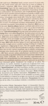 Tył opakowania serum Beauty of Joseon Ginseng Revive z czarnym tekstem składników i instrukcji na beżowym tle.