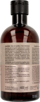 Tył brązowej butelki żelu Cashmere do kąpieli i pod prysznic, z czarną nakrętką, widoczną etykietą i pojemnością 400 ml.