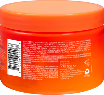 Tył pomarańczowego słoika Cantu Guava & Ginger Curl Styling Cream z listą składników i kodem kreskowym, widoczny pod kątem.