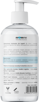 Tył białej butelki momme z emolientową śmietanką do kąpieli dla dzieci, widoczne naturalne składniki.