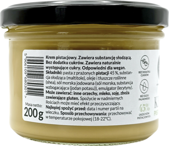 Szklany słoik kremu pistacjowego Foods by Ann, widok z tyłu, z etykietą i kodem kreskowym.