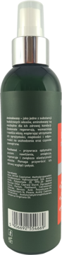 Tył ciemnozielonej butelki sprayu zwiększającego objętość włosów, z etykietą i kodem kreskowym.