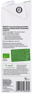 Tył białego kartonu napoju owsianego enerBiO waniliowego, z listą składników, kodem kreskowym i logo BIO.
