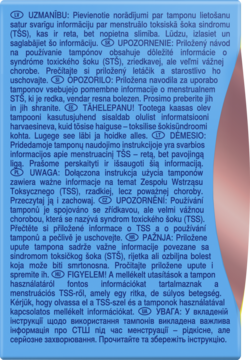 Niebiesko-zielona etykieta z wielojęzycznym ostrzeżeniem o syndromie wstrząsu toksycznego (TSS) przy użyciu tamponów.